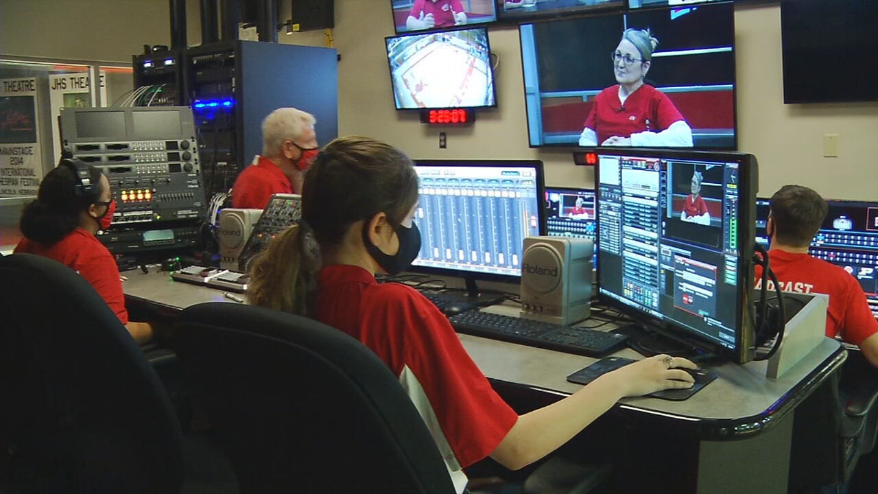 Jeffersonville High School students work inside studio